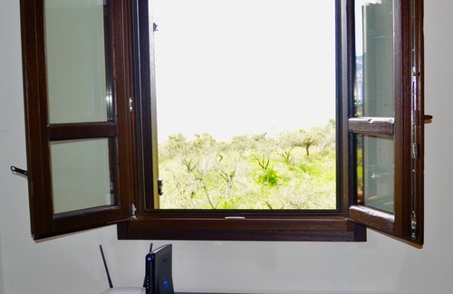 Dorgali Villa | VILLA en piedra sarda rodeada de vegetación. Terraza panorámica, barbacoa y zona de relax.