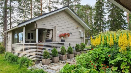 Taivalkoski Chalet De Esquí | Villa Salme lemmikkiystävällinen mökki Taivalkoskella Jokijärven rannalla