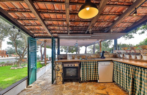 Businci Villa | Villa Strmo - Trogir-Ciovo-waterfront villa, hot tub, boat, summer kitchen.
