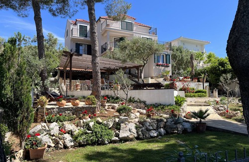 Businci Villa | Villa Strmo - Trogir-Ciovo-waterfront villa, hot tub, boat, summer kitchen.