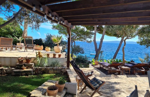 Businci Villa | Villa Strmo - Trogir-Ciovo-waterfront villa, hot tub, boat, summer kitchen.