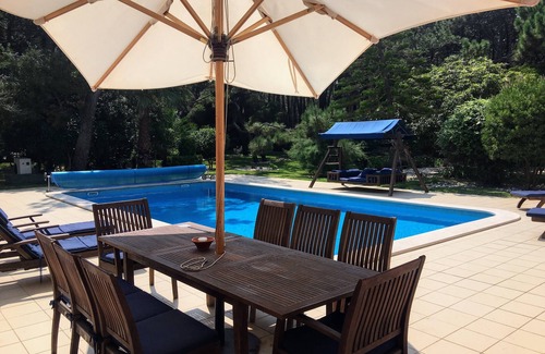 Praia del Rei Villa | Libros, sol, cama columpio, piscina privada climatizada y amplio jardín para que disfrutes