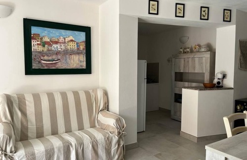 Villaggio Piras Cabaña | Villetta Rosa - Villa con jardín, paisaje encantador.