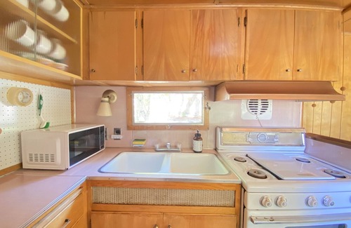 Kernville Casa | Vintage wood paneled travel trailer on Kernville Ranch with horses and hot tub