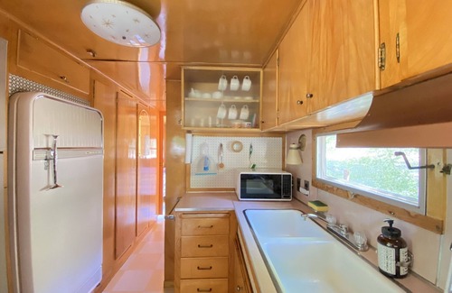 Kernville Casa | Vintage wood paneled travel trailer on Kernville Ranch with horses and hot tub