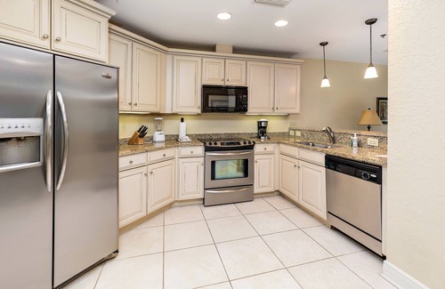 Demere Park Condominio | Walk or Bike to Pier and Village from Salt Air Villas! Community Pool and Private Balcony