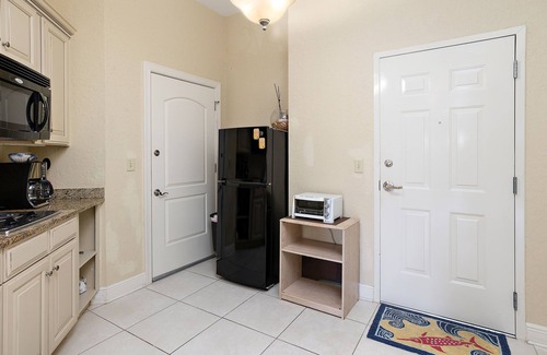Demere Park Condominio | Walk or Bike to Pier and Village from Salt Air Villas! Community Pool and Private Balcony
