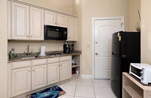 Demere Park Condominio | Walk or Bike to Pier and Village from Salt Air Villas! Community Pool and Private Balcony