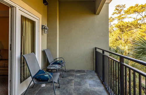 Demere Park Condominio | Walk or Bike to Pier and Village from Salt Air Villas! Community Pool and Private Balcony
