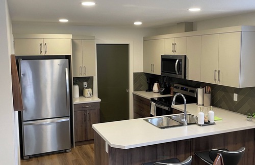 Lethbridge Casa | Walkout full separate 2BR 1Bath 3 queen beds suite. Separate entrance. Laundry.