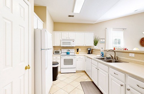 Sunset Beach Condominio | Waterfront condo with pool, tennis, bikes & lagoon/golf views - near the beach