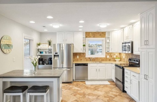 Colington Harbour Casa | Waterfront! Game Room, Hot Tub, Kayaks, SUPSs, Fire Pit, Theater Room, Dogs OK