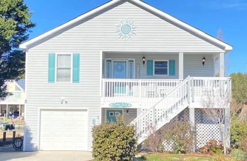 Colington Harbour Casa | Waterfront! Game Room, Hot Tub, Kayaks, SUPSs, Fire Pit, Theater Room, Dogs OK