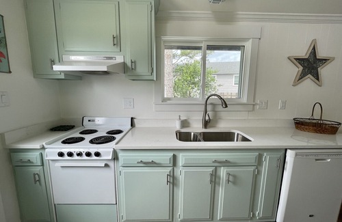 Colington Harbour Cabaña | Waterfront Harbor Home, Sunset Views, Fireplace, Private dock and Boat Slip
