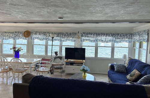 Laconia Casa | WATERFRONT HOME BOAT HOUSE BOAT SLIPS PANORAMIC LAKE AND GUNSTOCK MOUNTAIN VIEW