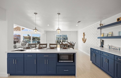 Channel Islands Casa | Waterfront home with kayaks, grill, Pac-Man, AC, balconies, & smart TVs