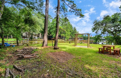 Montgomery Casa | Waterfront house with a large deck and dock for boat or fishing