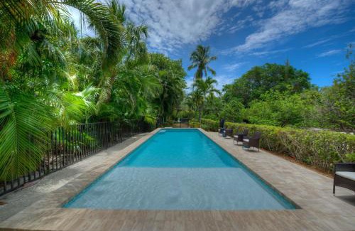Captiva Casa | Waterfront Pink House with Private Dock & Pool
