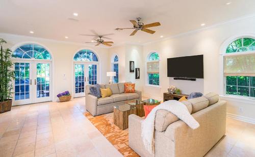 Captiva Casa | Waterfront Pink House with Private Dock & Pool