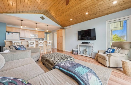 Miller Lake Cabaña | Watersedge: 4BR Miller Lake cottage with dock, firepit, decks, spacious interiors, rec room & foosball.