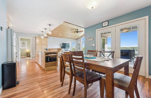 Miller Lake Cabaña | Watersedge: 4BR Miller Lake cottage with dock, firepit, decks, spacious interiors, rec room & foosball.