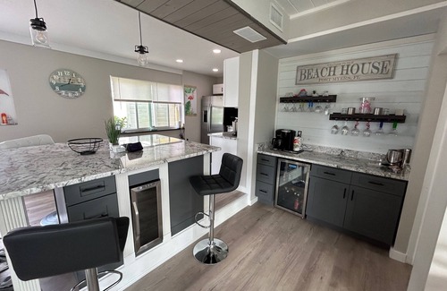 South Island Casa | WE ARE BACK! NEWER POOL/SPA and Walk to beach! Totally updated Canal front home!