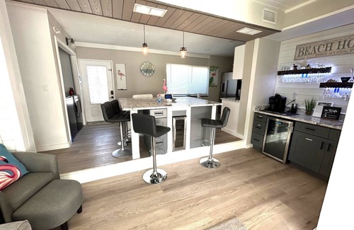 South Island Casa | WE ARE BACK! NEWER POOL/SPA and Walk to beach! Totally updated Canal front home!
