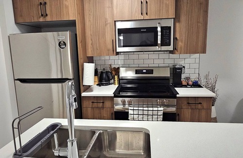 Regina Casa | Welcome to Heartland Suite-Your Modern Retreat in "The Greens"!