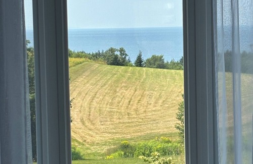 Inverness County Casa | Where the Ocean Meets Rolling Hills in a Picturesque Landscape