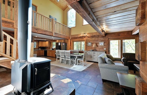 Iron River Cabina | Whispering Waters Lodge with Waterfall, Pond and Trails on Property in Delta, WI