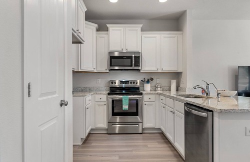Thomas Drive Casa | Winter rental rates available! Close to Publix Sports Park! Community Pool!