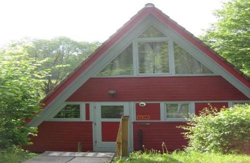 Machtlos Casa | Wooden bungalow with a terrace in a wooded area