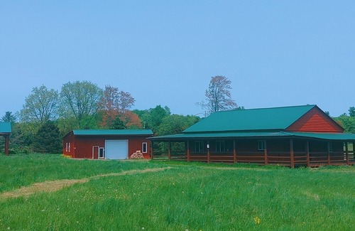 Gerry Cabina | Woodys Retreat this rental includes the barn outdoor covered fire pit