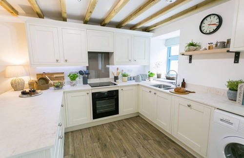 Llanddaniel Fab Cabaña | Ysgubor Wennol (Swallow Barn) - a cosy fire that sleeps 4 guests in 2 bedrooms