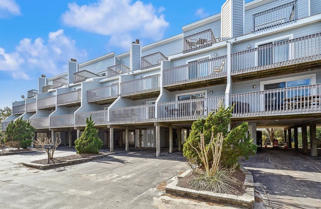 Activities included up to $300 FREE PER WEEK!! NEW LISTING 2024! Beautifully decorated vacation townhome in North Bethany approximately 300 feet from the beach and nestled behind the dunes with a private boardwalk taking you out to the surf and sand!