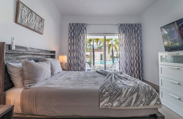 Apartment steps from the beach and overlooking the pool