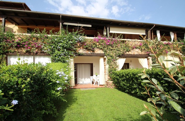 Appartamento a Pochi Passi dal Mare con Patio e Giardino Privato