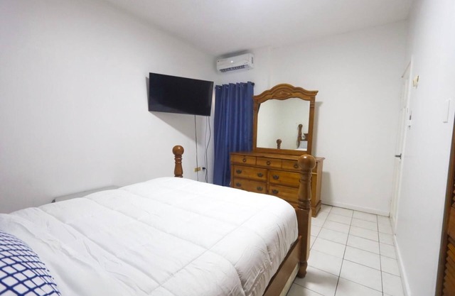 Apt. In gated community near Bob Marley Museum with a pool