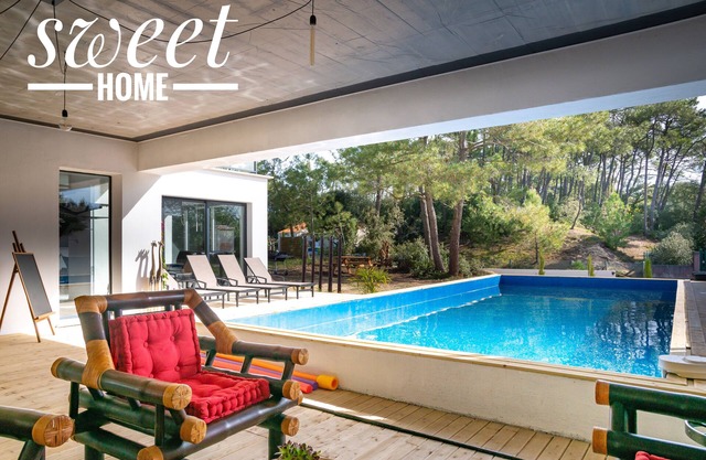 casa de arquitecto con piscina climatizada, a 250 metros de la playa, frente al bosque