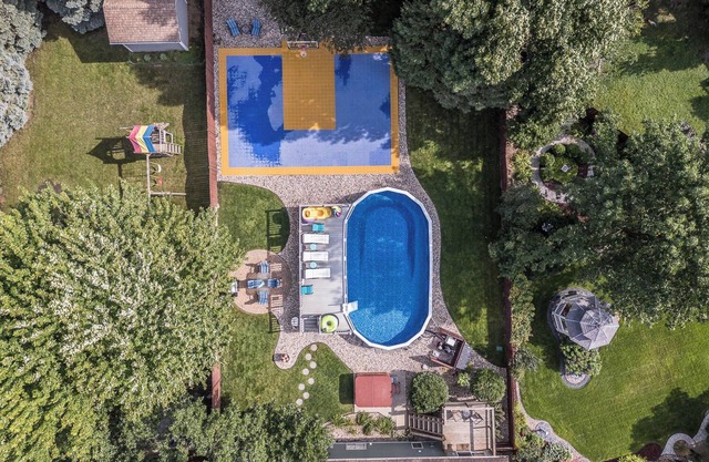 Hot tub, game room, XL pool, garage, luxurious, while also family friendly.