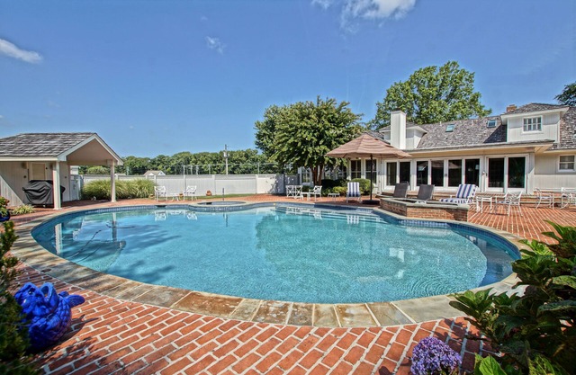 Beautiful custom home on 1.5 acres with large heated saltwater pool and spa!