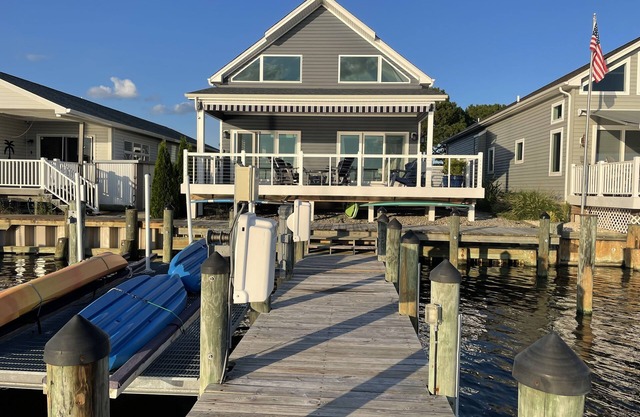 Beautiful, single home on a wide canal with boat slip and large pier.
