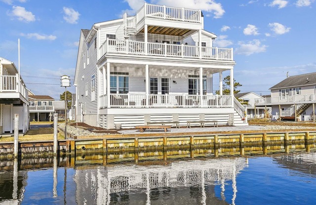 BOOK BEFORE JUL 15 TO SAVE 10% OFF OPEN AUG WEEKS! **Rates listed reflect discount Activities included up to $300 FREE PER WEEK!! NEW LISTING 2024! BRAND NEW CONSTRUCTION! Exceptional waterfront custom vacation home is located on a canal in famil
