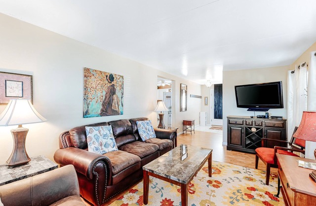 Charming waterfront house with heated pool, hot tub, & W/D - snowbird-friendly