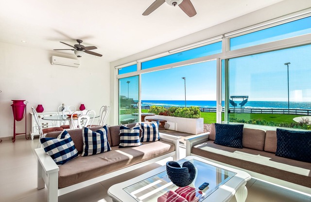 Cheerful dog-friendly villa with beach views, outdoor pool, private patio, & AC