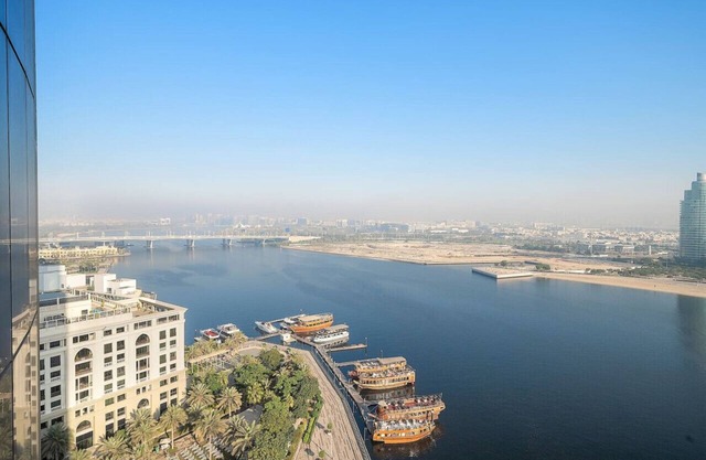 Cozy Waterfront Stay with Balcony, Kitchen & Smart TV
