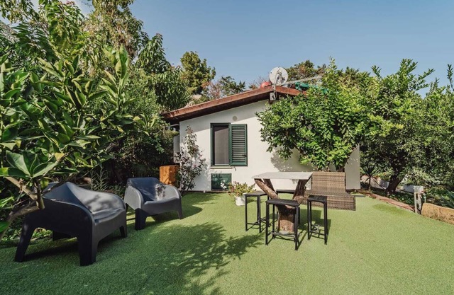Duplex House detached cottage with whirlpool surrounded by citrus trees