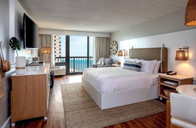 Enjoy Panoramic Ocean Vistas from Your Inviting Beachside Room