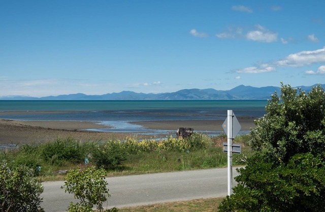 Escape to the tranquil Helme Holiday Bottom Bach, kiwi charm on beautiful Kina Peninsula