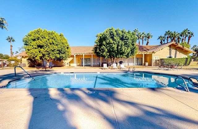 Gated community home with 2 pools, hot tubs, private patio, AC, & W/D